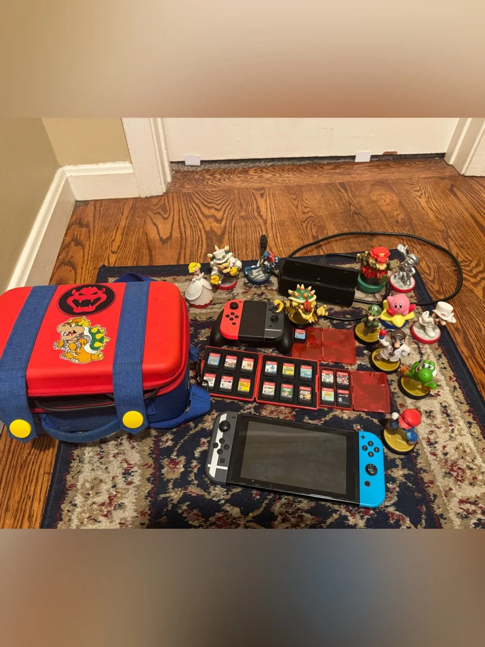 Nintendo Console Bundle with Red and Blue Joy-Cons and Red Carry Case